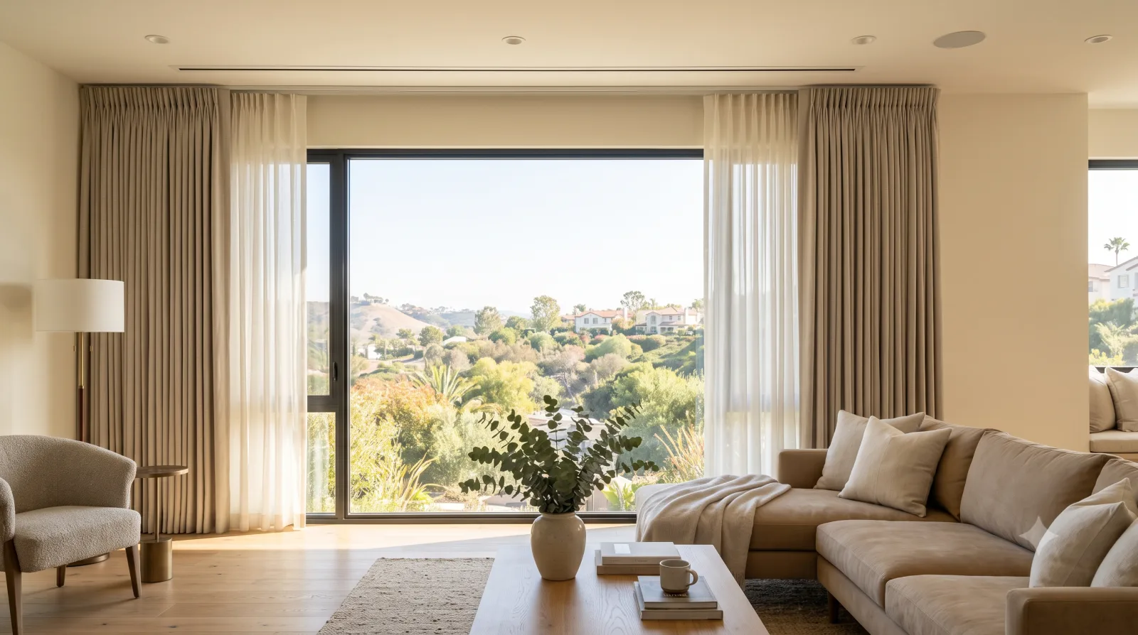 Layered curtains open in a warm living room